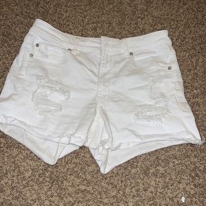 white jean shorts w/ flower pockets
